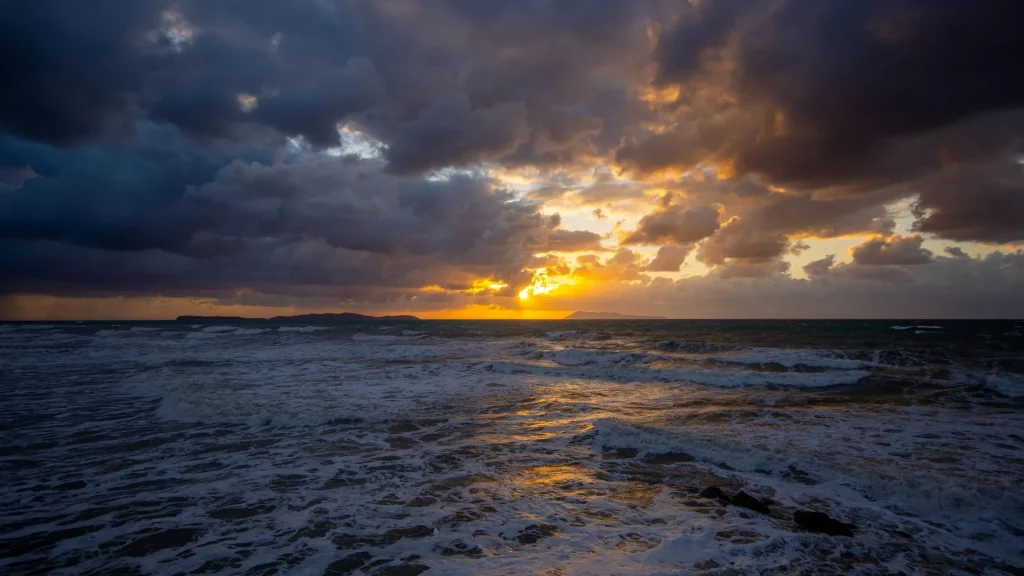 dramatic-ocean-sunset-turbulent-coastal-seas.webp.webp